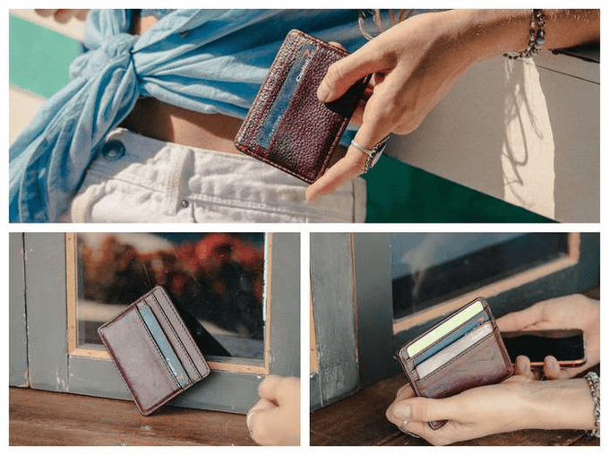 a woman is opening a wallet with her hand